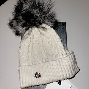 Cable knit and rib knit wool and cashmere-blend beanie in off-white with fur top